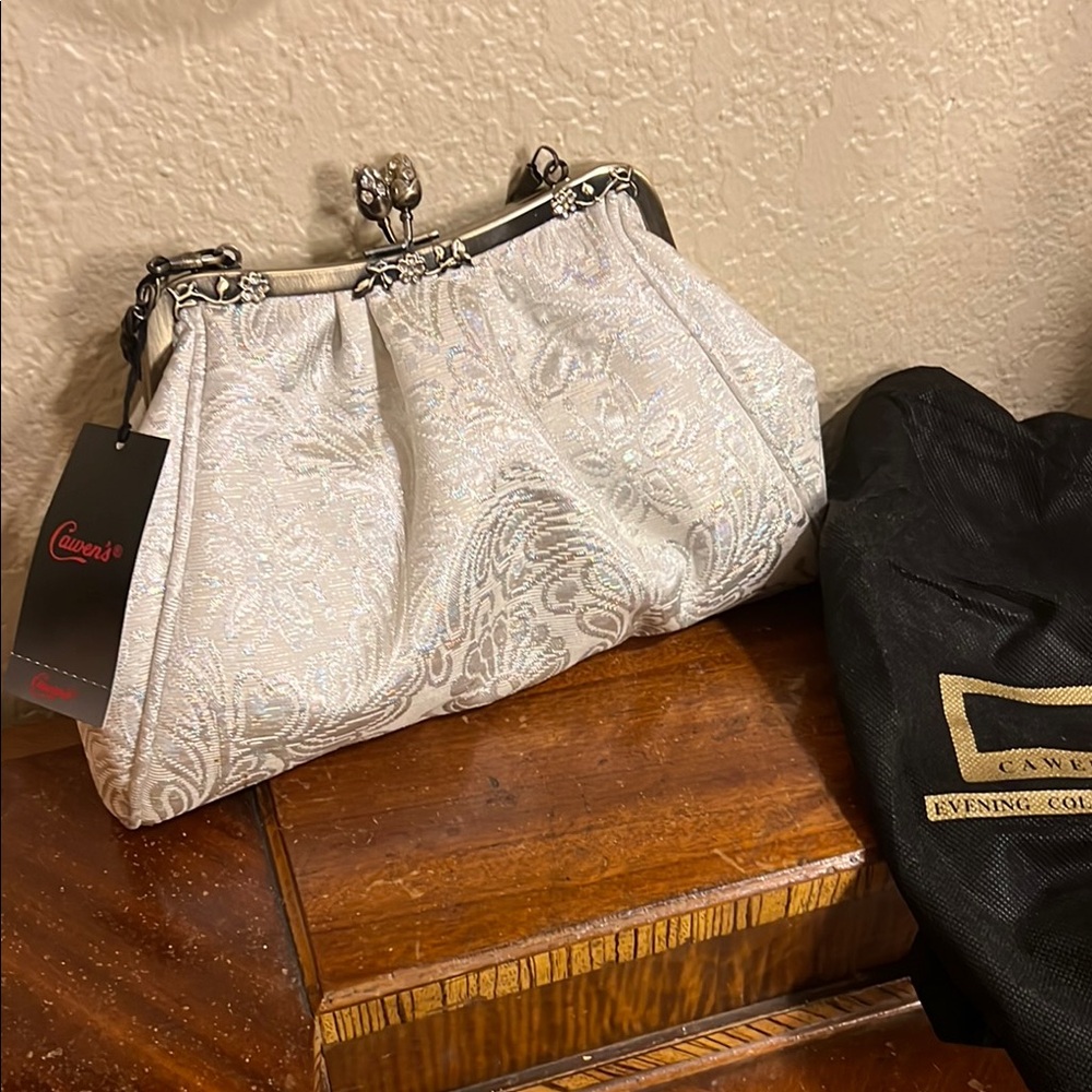 🔥Shimmering White/Silver Clutch with Ornate Clasp and Textured Design NWT